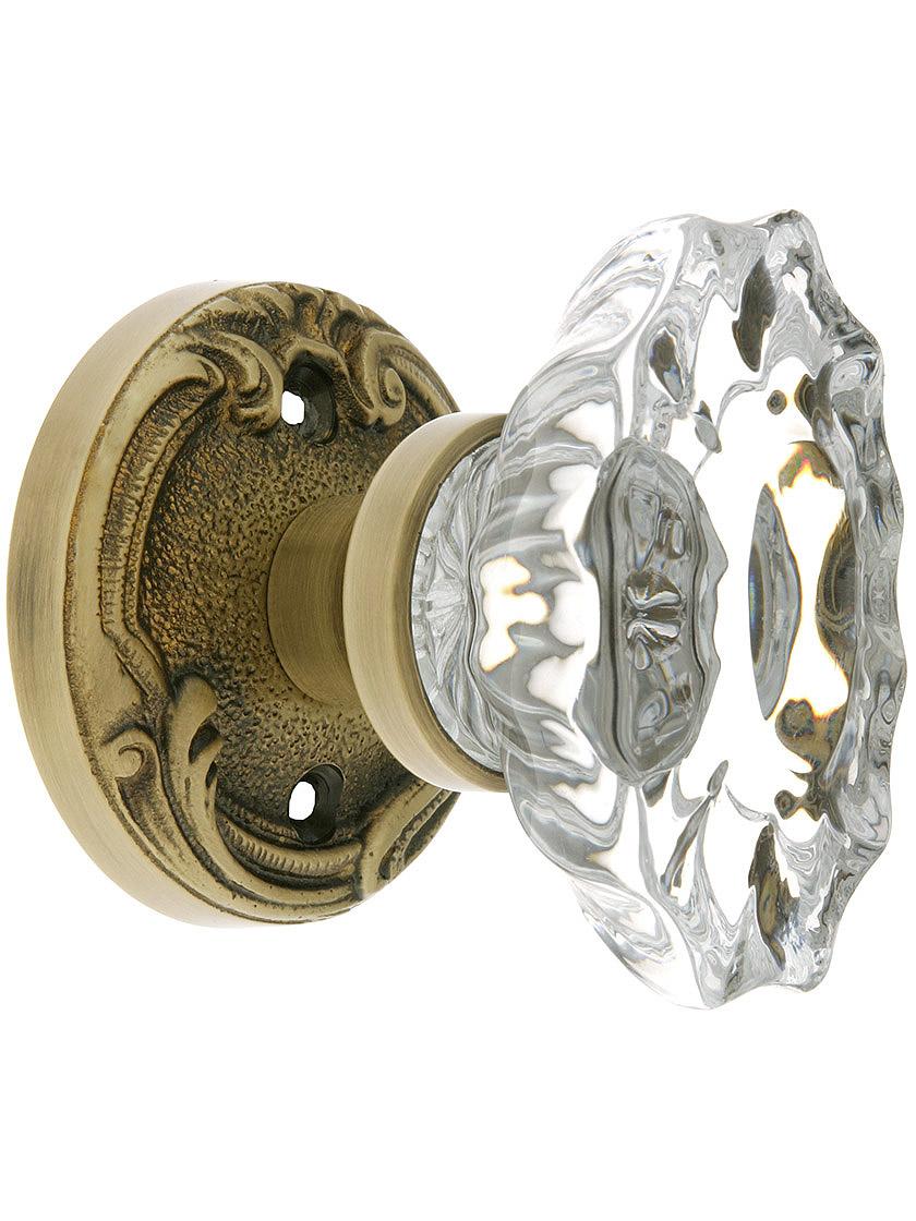 Lafayette Rosette Door Set With Fluted Oval Crystal Knobs in Antique Brass.